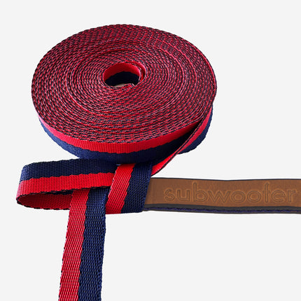 close-up-of-red-and-navy-striped-webbing-and-brown-leather-tab-on training-line