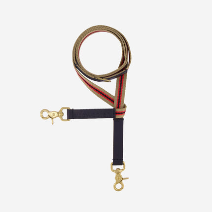 clearcut-view-rom-above-of-sand-red-striped-dog-lead-with-black-leather-accents-and-brass-hardware