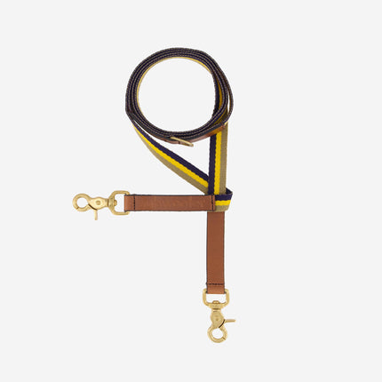 subwooferdog-clearcut-from-above-dog-leash-with-yellow-sand-and-navy-striped-webbing-brown-stamped-leather-handle-and solid-brass-hardware